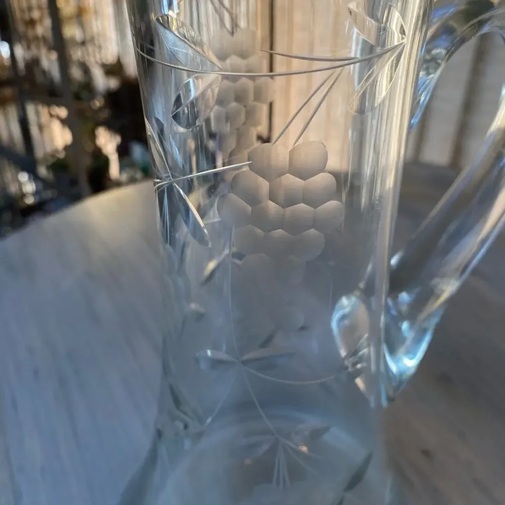 Vintage wine pitcher with etched grapes